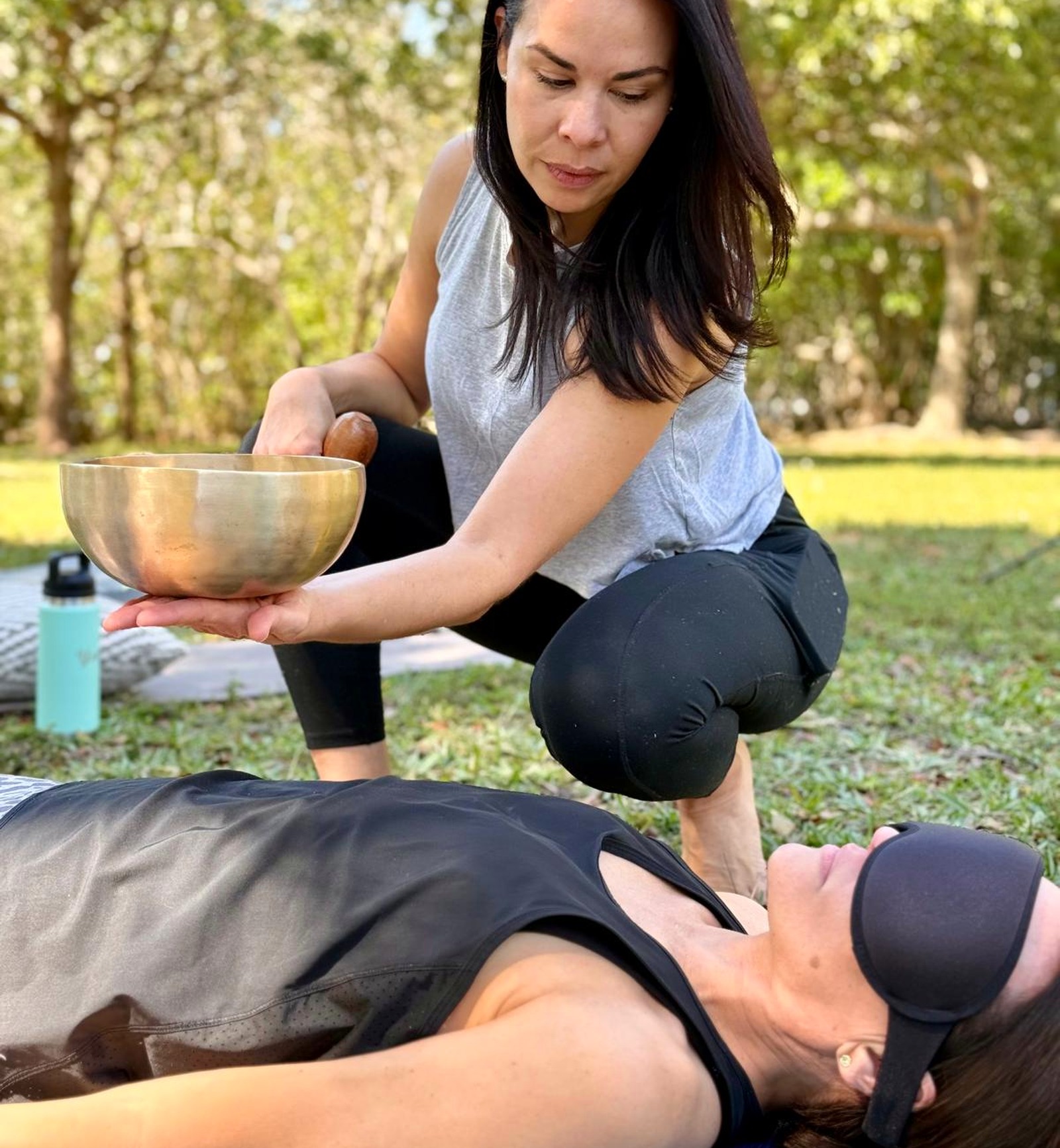 Karina holding a crystal singing bowl