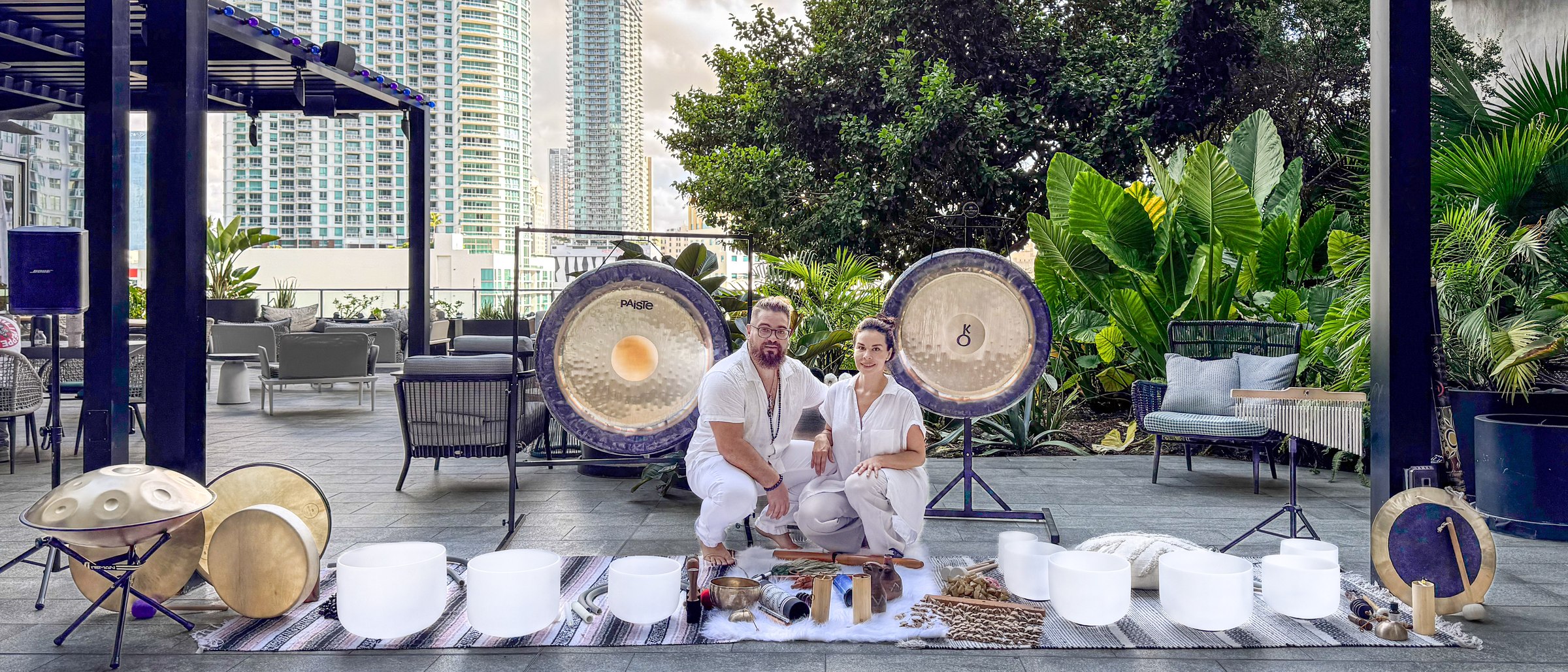 Juan and Karina between the two gongs with the full set of instruments